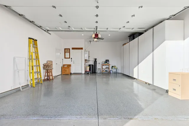 a bedroom with a bed and a chair