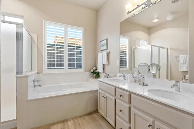 a bathroom with a bathtub and a shower