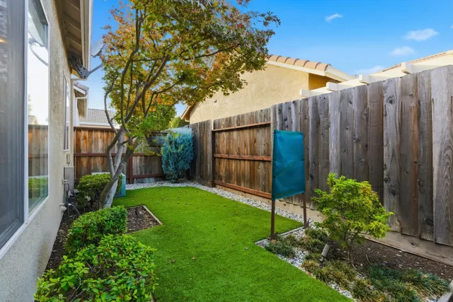 an aerial view of a house with outdoor space
