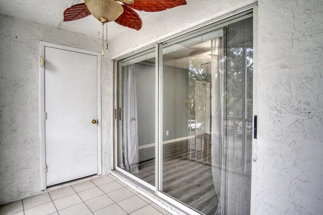 a bathroom with a glass shower door