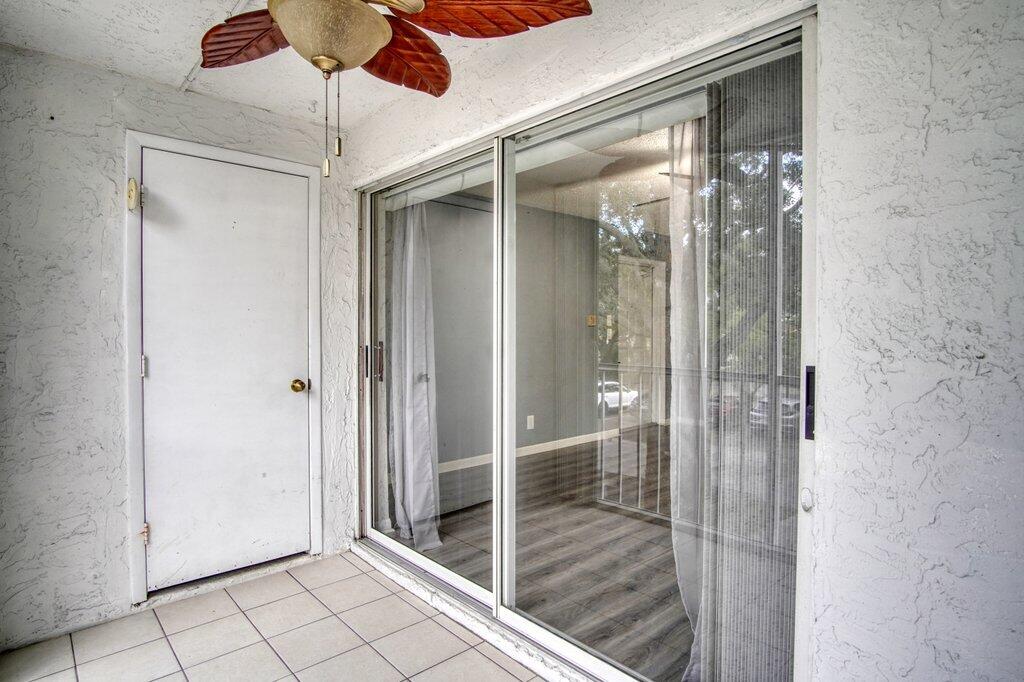 2500 Southeast Anchorage Cove, Unit B2 Port St. Lucie, FL 34952 - Photo 24 of 25 a bathroom with a glass shower door