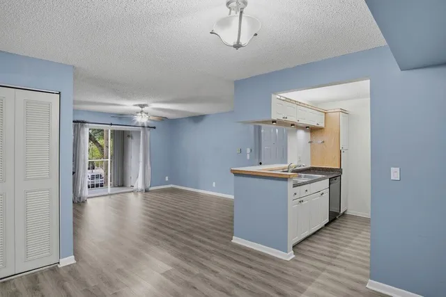 a kitchen with granite countertop a stove and a sink
