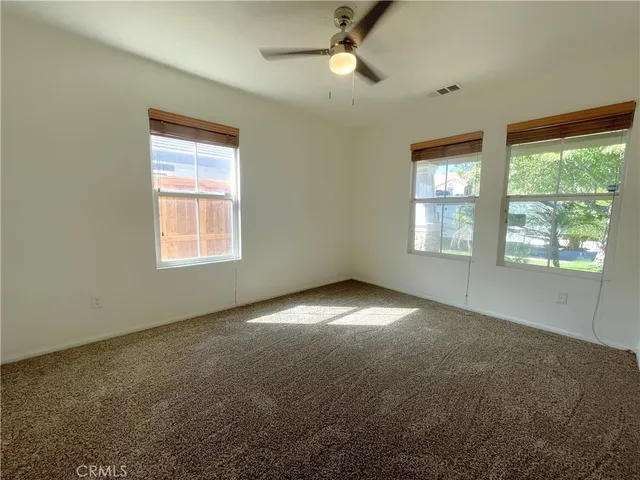 a view of empty room with windows