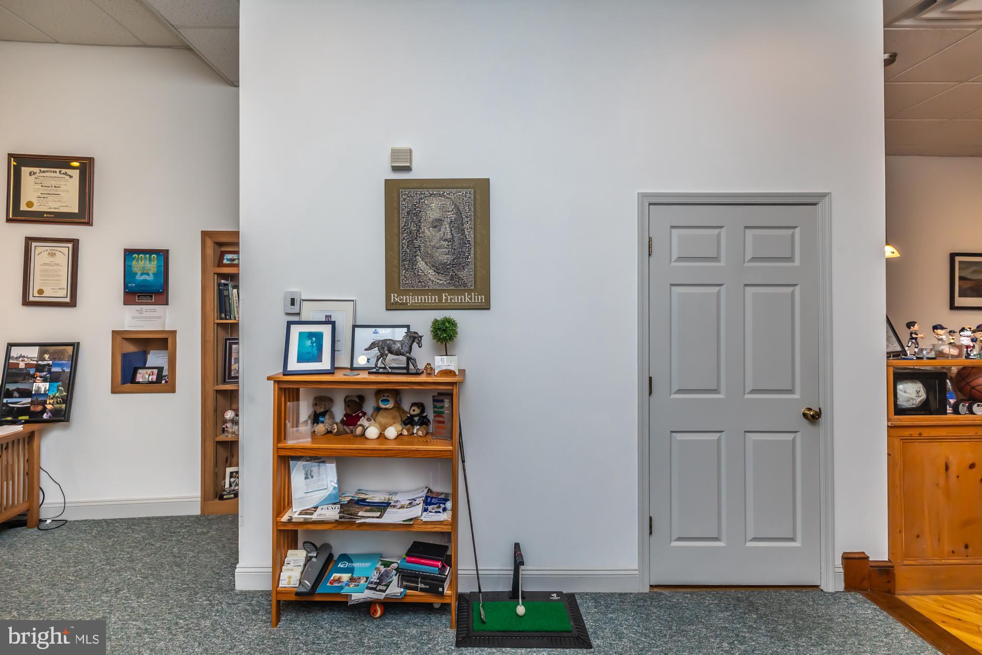 107 West State Street Kennett Square, PA 19348 - Photo 13 of 52 a living room with lots of furniture and a window
