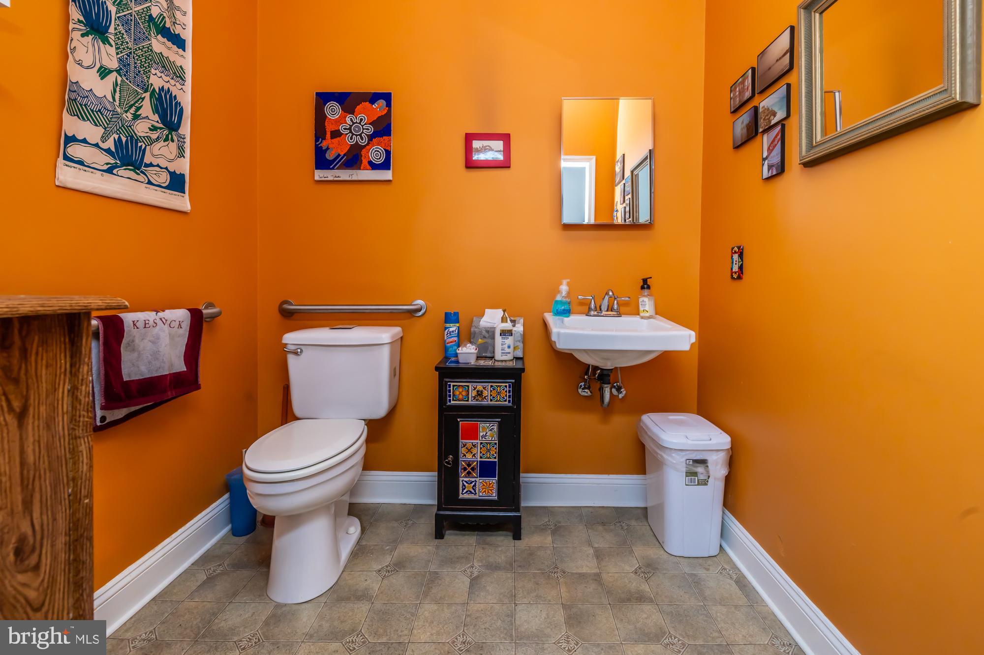 107 West State Street Kennett Square, PA 19348 - Photo 14 of 52 a bathroom with a toilet and a sink