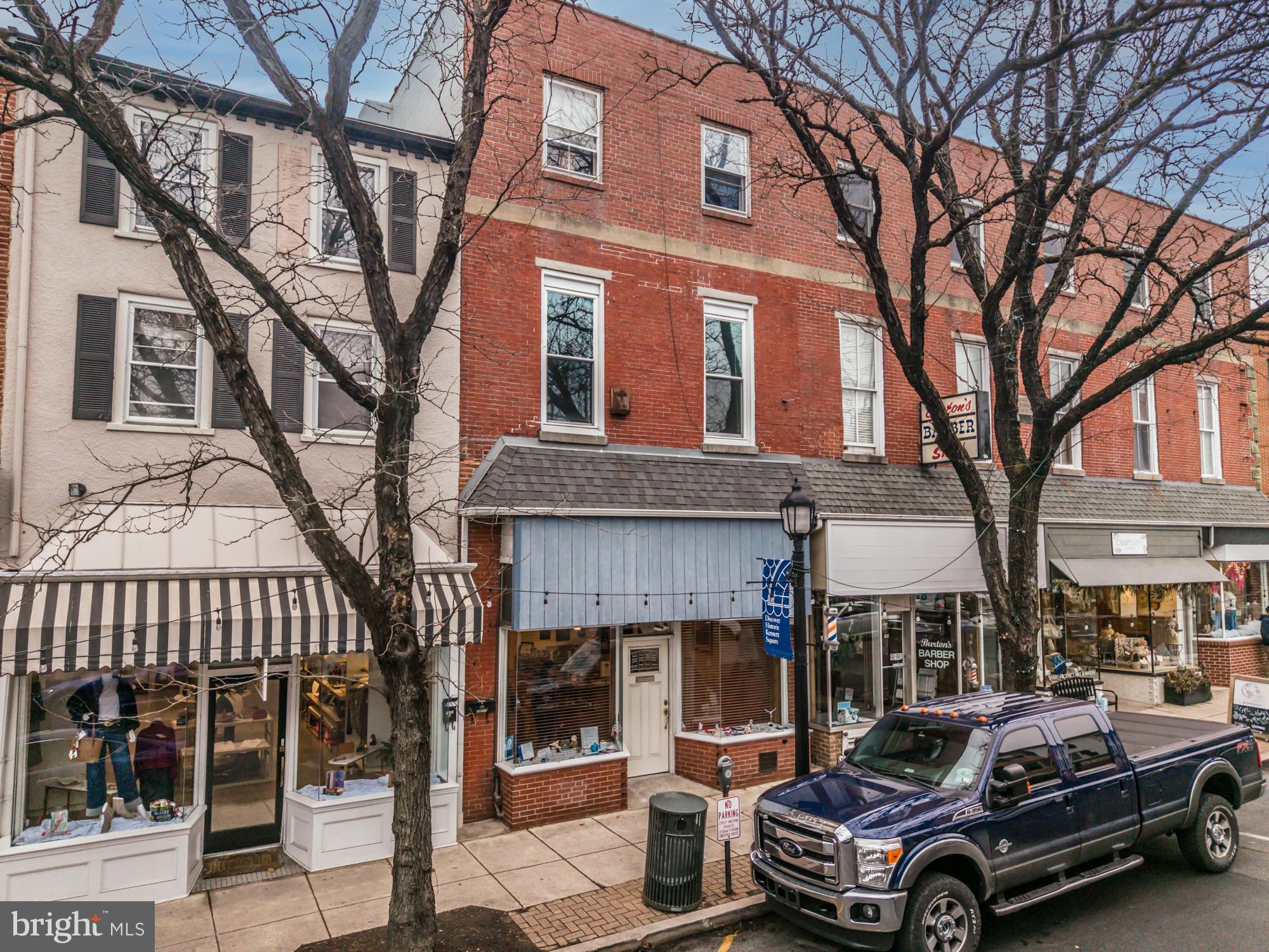 107 West State Street Kennett Square, PA 19348 - Photo 2 of 52 a car parked in front of a brick house