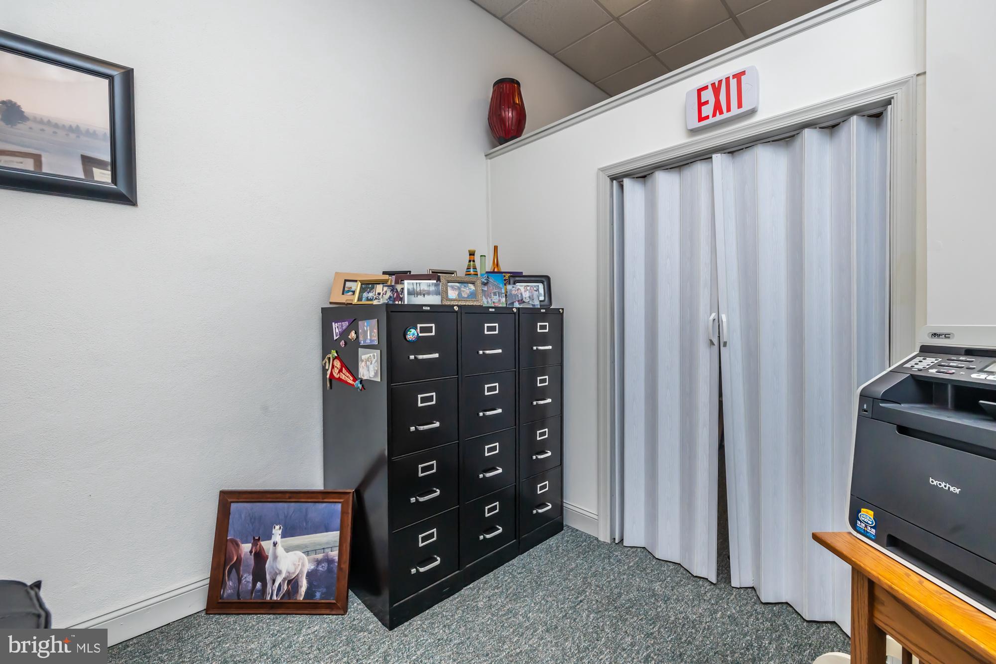 107 West State Street Kennett Square, PA 19348 - Photo 21 of 52 a view of a livingroom with wooden floor