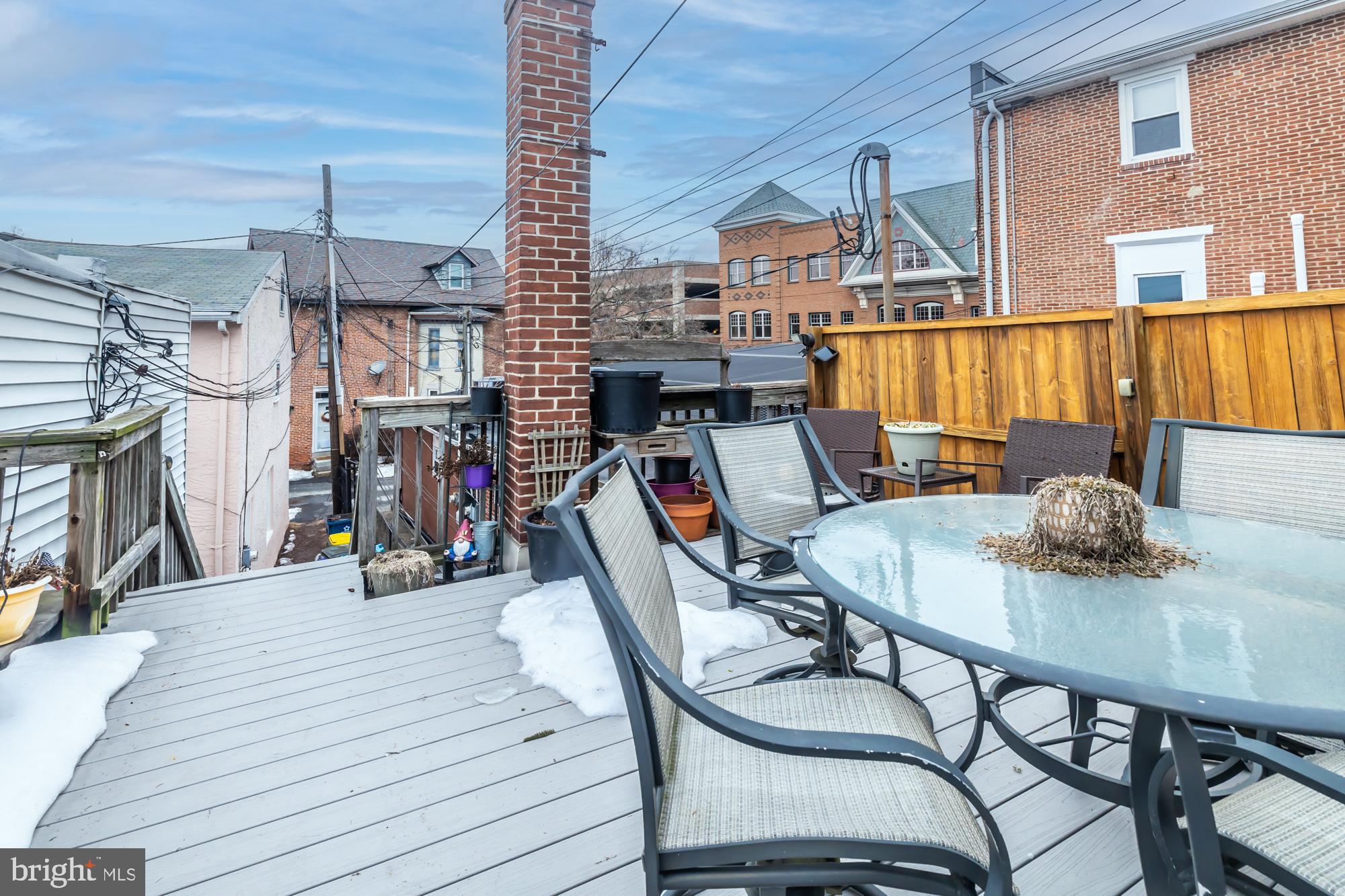 107 West State Street Kennett Square, PA 19348 - Photo 27 of 52 a view of a dining room with furniture and wooden floor