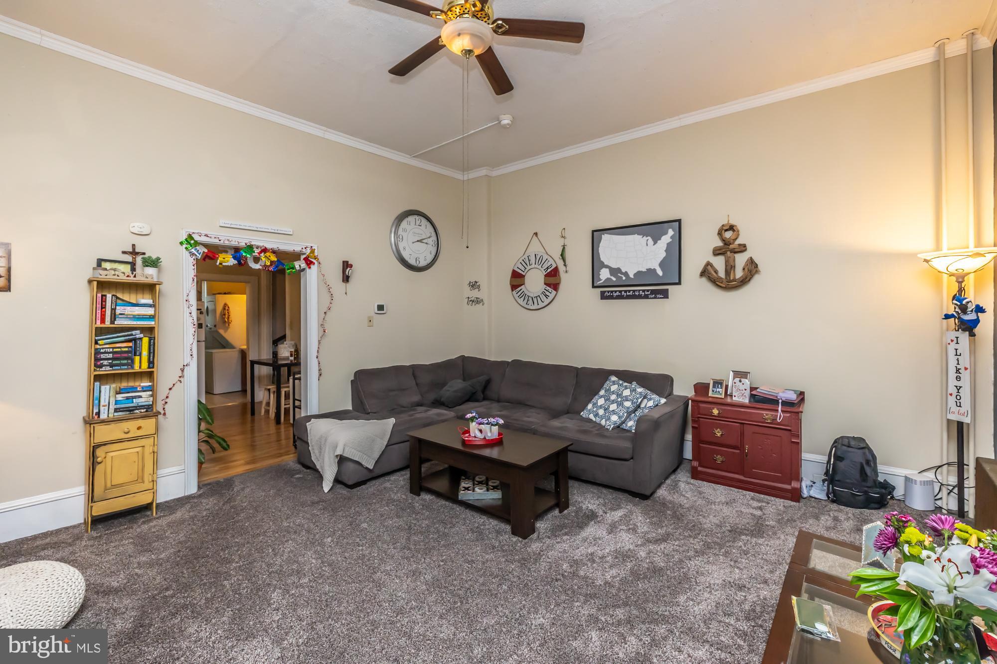 107 West State Street Kennett Square, PA 19348 - Photo 32 of 52 a living room with furniture and a window