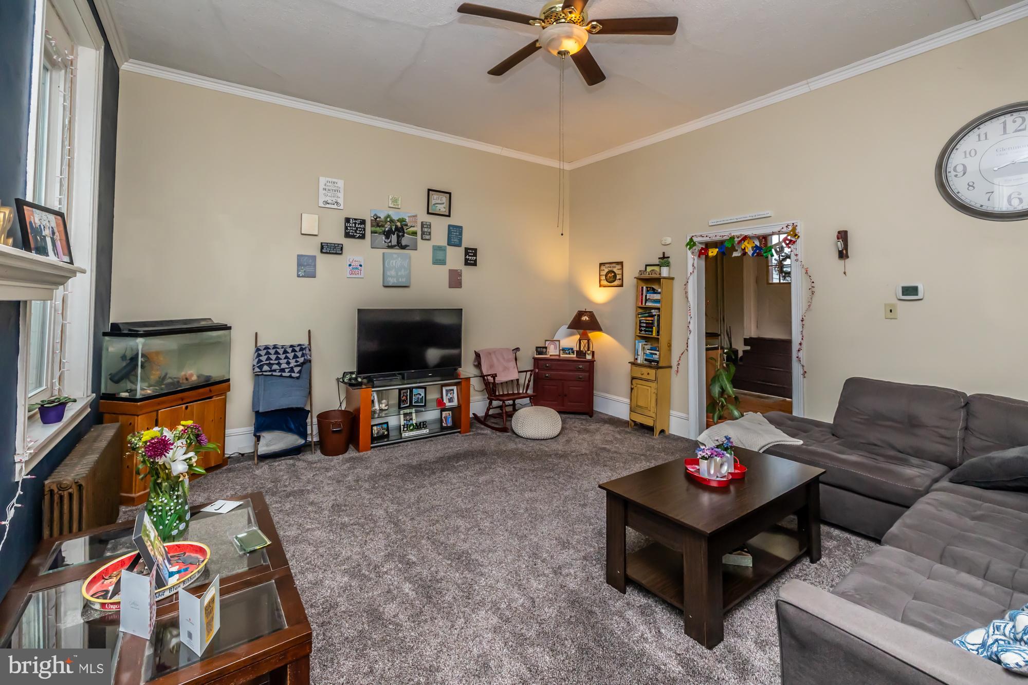 107 West State Street Kennett Square, PA 19348 - Photo 33 of 52 a living room with furniture and a flat screen tv