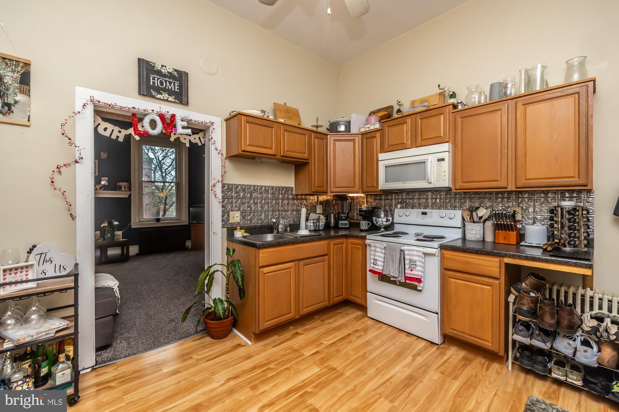107 West State Street Kennett Square, PA 19348 - Photo 38 of 52 a kitchen that has a lot of cabinets a sink and a stove in it