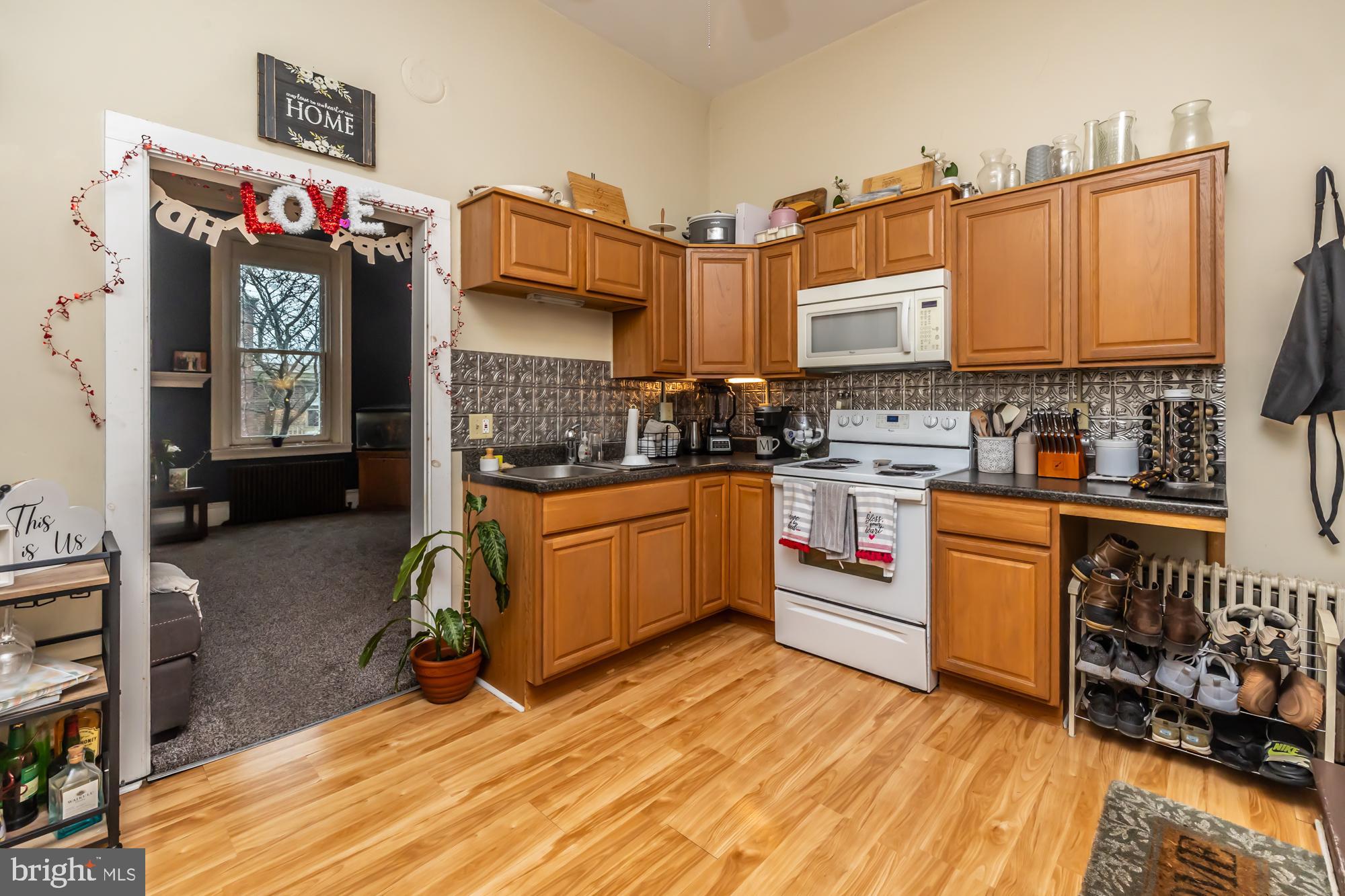 107 West State Street Kennett Square, PA 19348 - Photo 40 of 52 a kitchen with a sink stove and cabinets