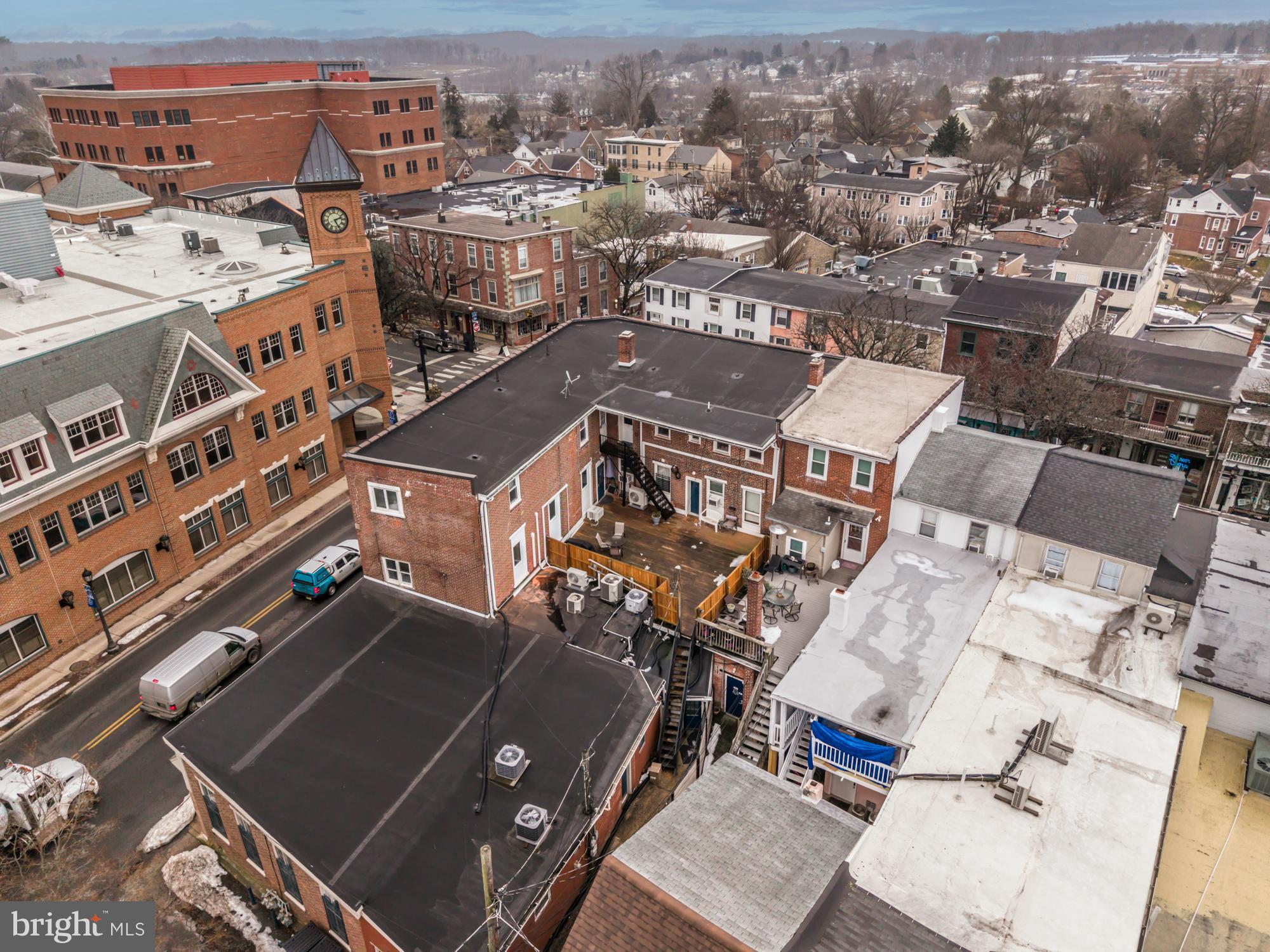 107 West State Street Kennett Square, PA 19348 - Photo 4 of 52 an aerial view of a building with many windows