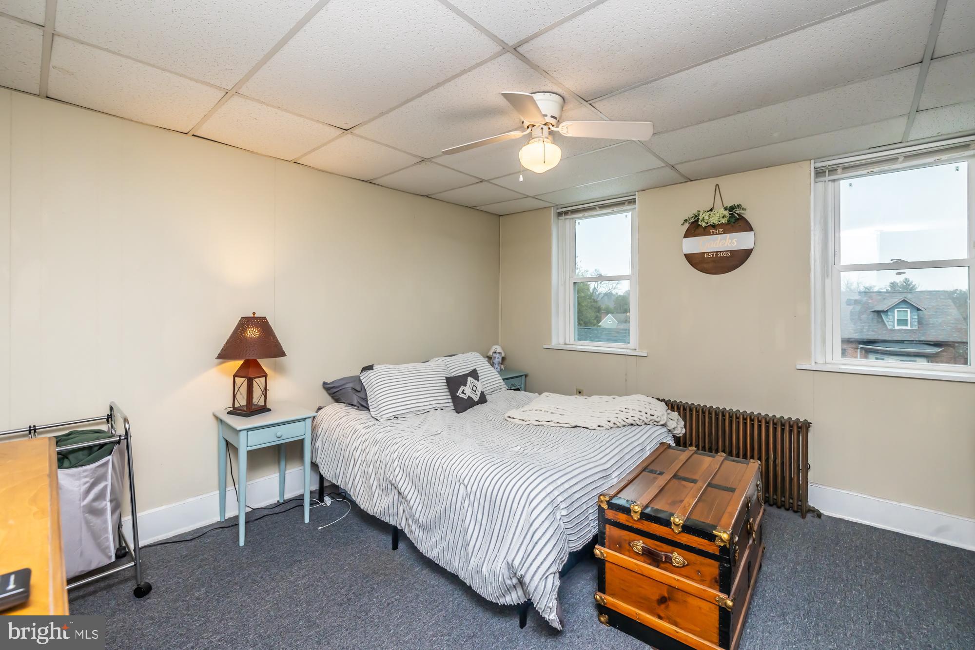 107 West State Street Kennett Square, PA 19348 - Photo 43 of 52 a bedroom with bed and a window