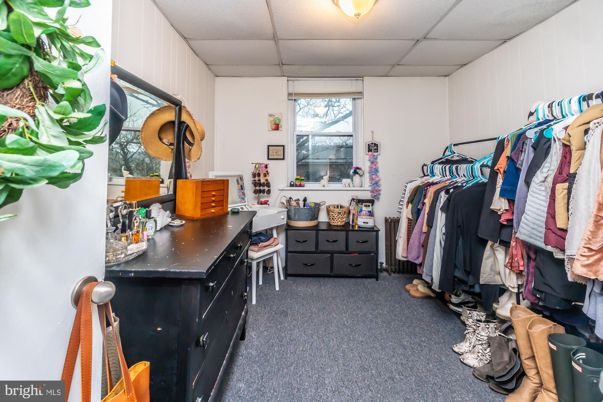 107 West State Street Kennett Square, PA 19348 - Photo 46 of 52 a view of walk in closet with clothes and shoes