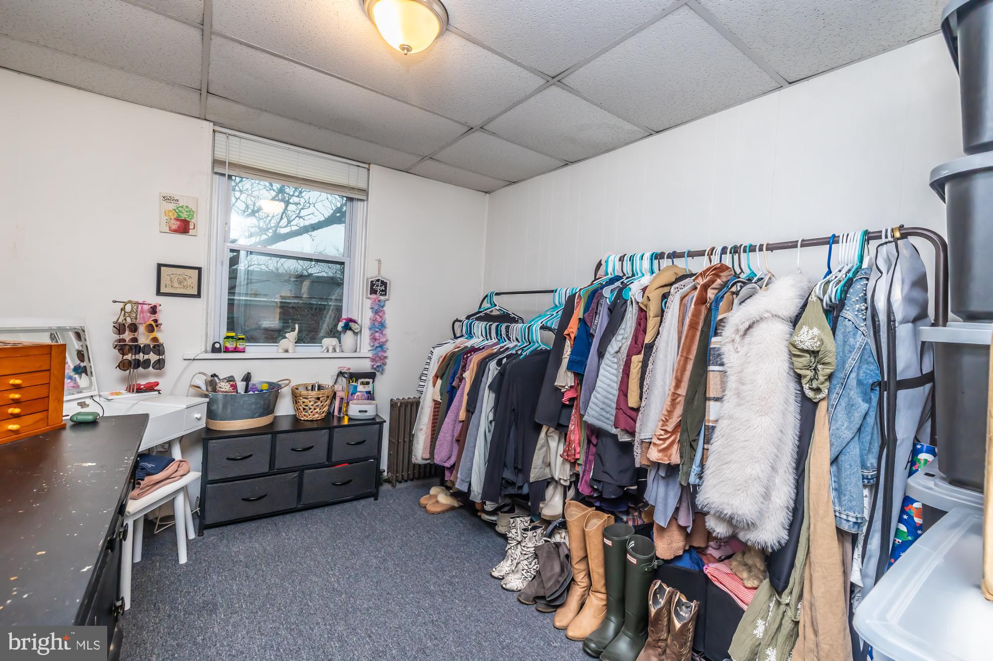 107 West State Street Kennett Square, PA 19348 - Photo 47 of 52 a view of walk in closet with clothes and shoes