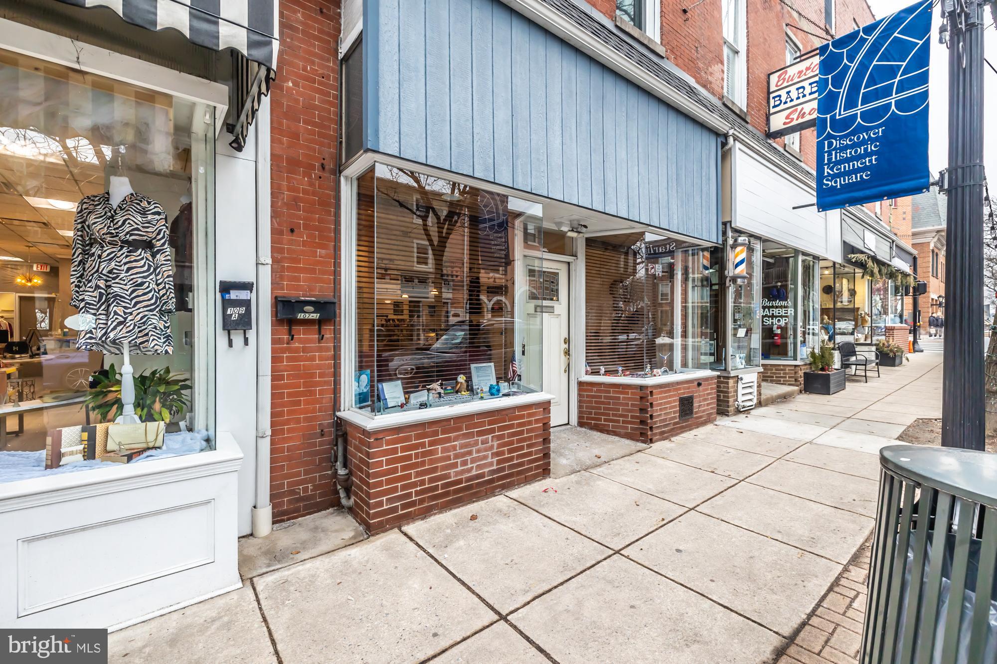 107 West State Street Kennett Square, PA 19348 - Photo 6 of 52 a view of entrance with building and glass door