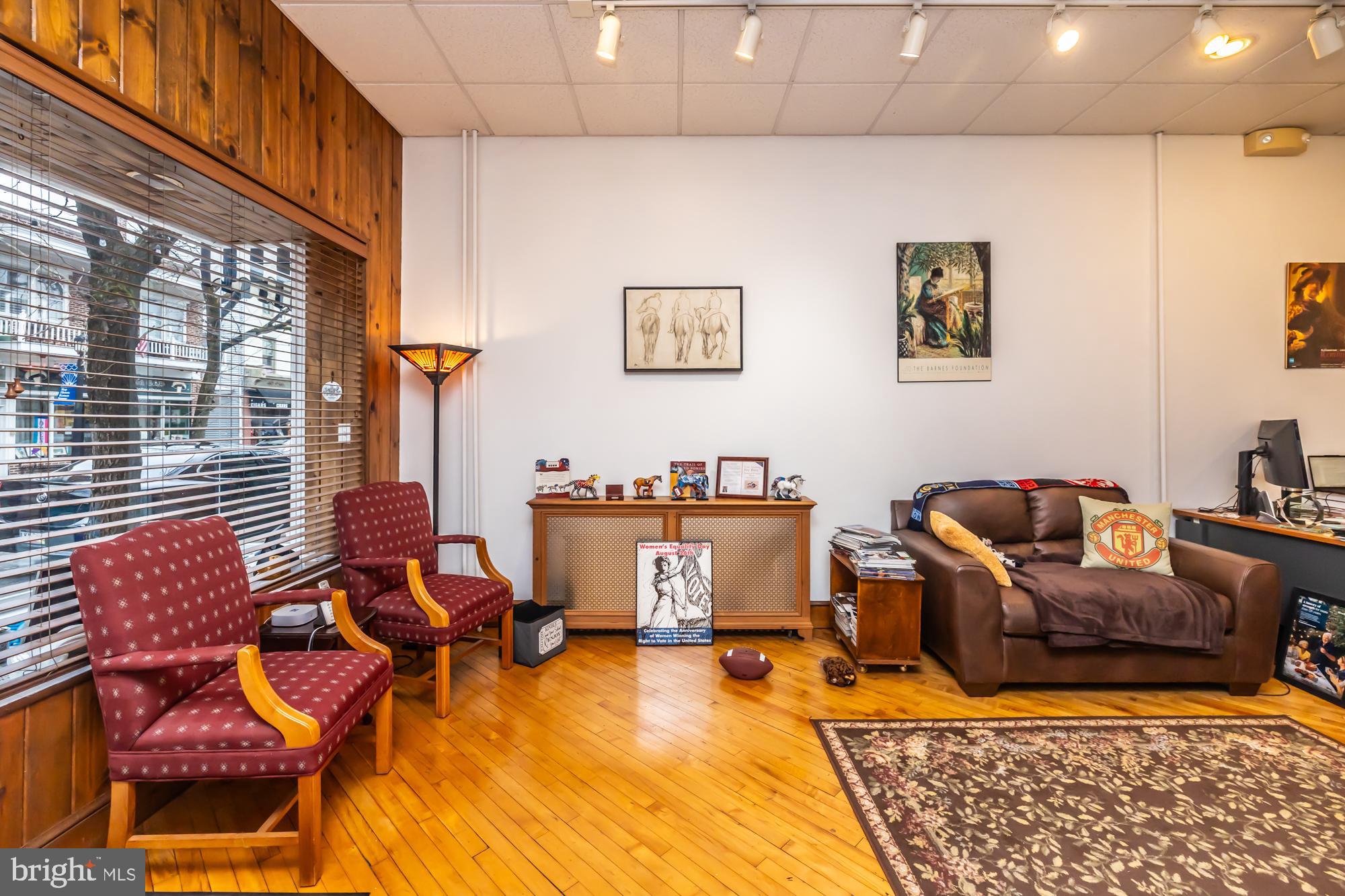 107 West State Street Kennett Square, PA 19348 - Photo 10 of 52 a living room with furniture