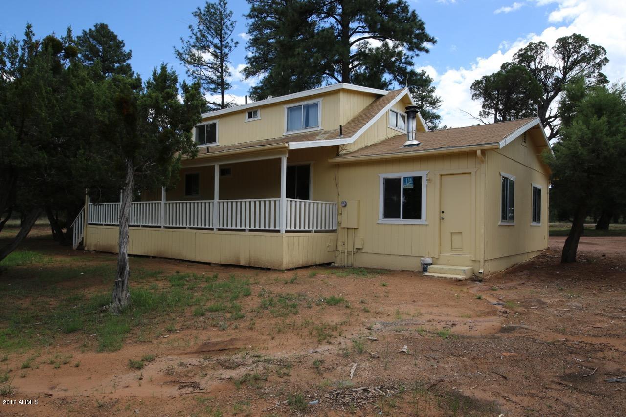 3070 Aspen Road Overgaard, AZ 85933 - Photo 13 of 38 a view of a house with a yard