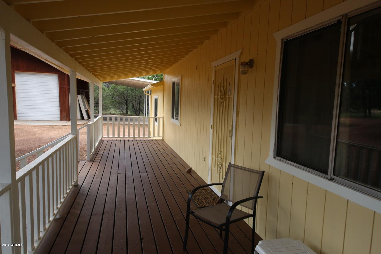 3070 Aspen Road Overgaard, AZ 85933 - Photo 15 of 38 a view of balcony with wooden floor