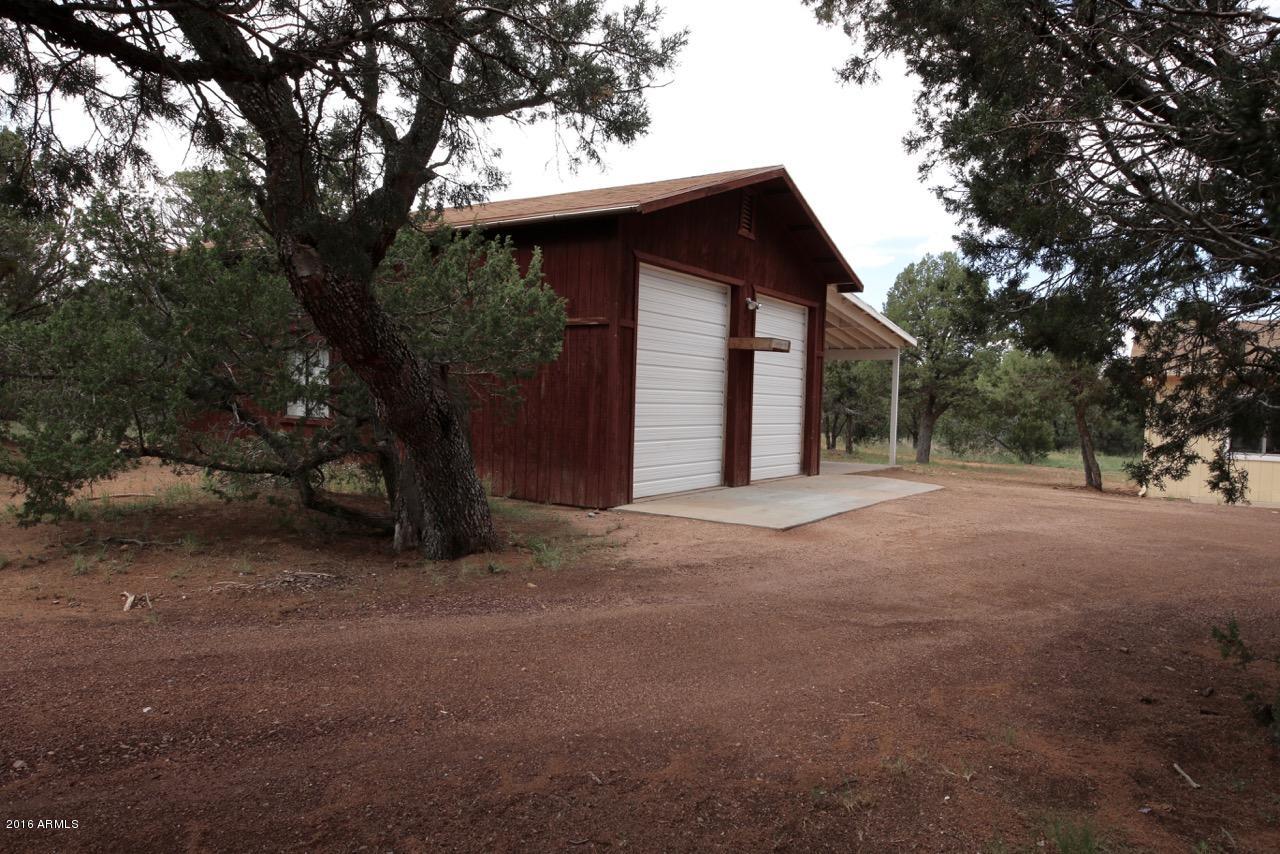 3070 Aspen Road Overgaard, AZ 85933 - Photo 2 of 38 a view of a house with a trees