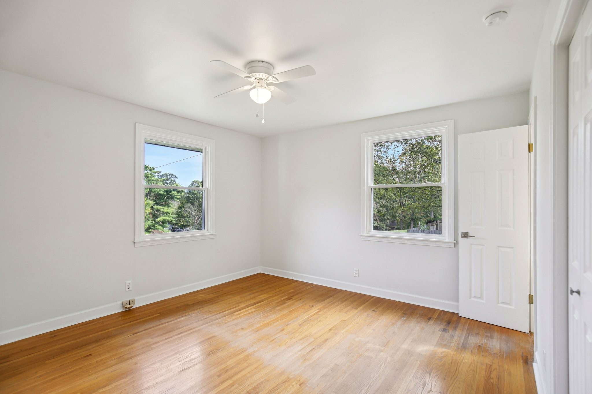 2411 Cloverdale Road Nashville, TN 37214 - Photo 16 of 33 a view of an empty room with wooden floor and a window