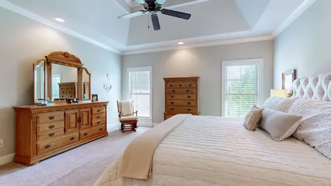 a bedroom with a bed and a dresser