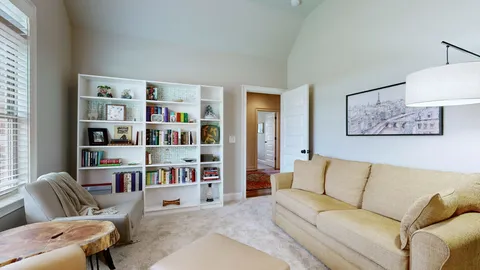 a living room with furniture cabinets and a shelf