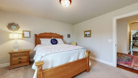 a bedroom with a bed and a cabinets