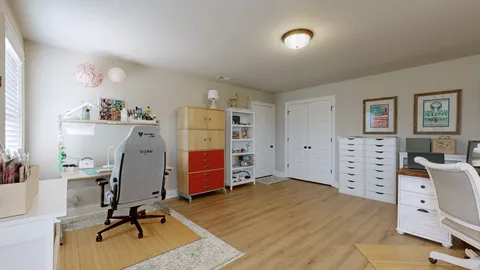 a view of a workspace with furniture and toys