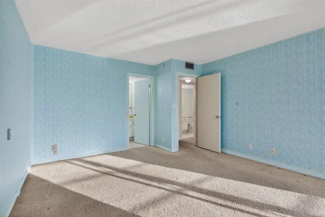 a view of a refrigerator in kitchen