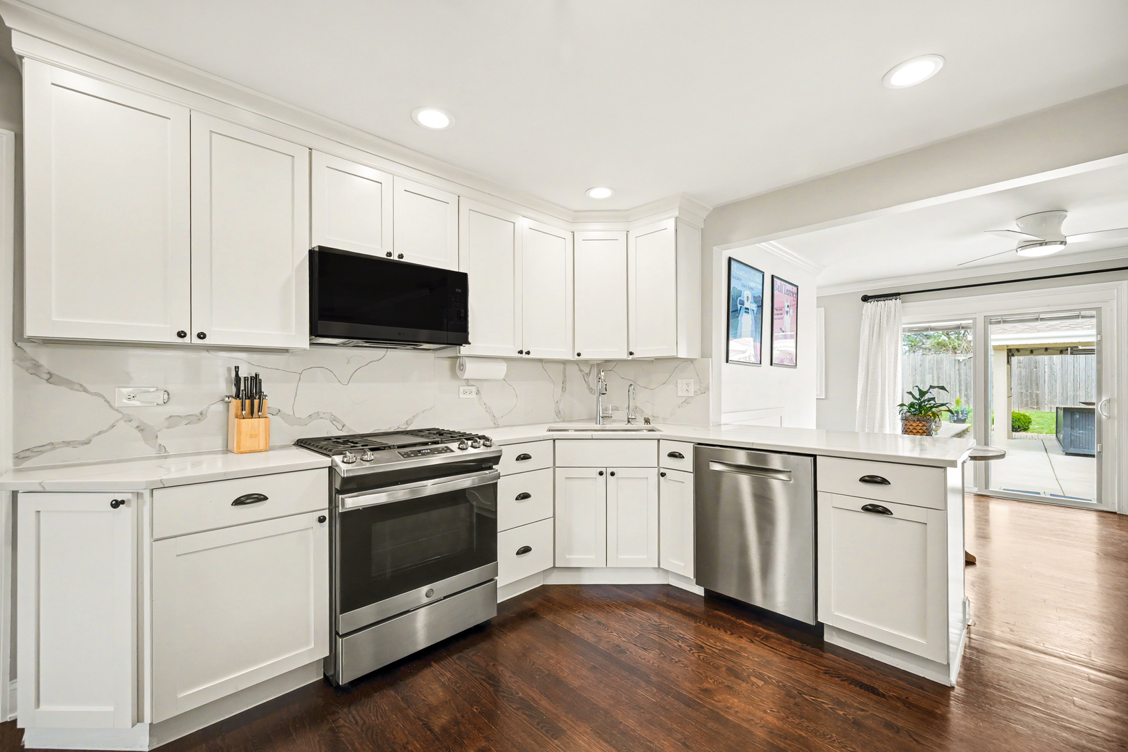 3S171 Arboretum Road Glen Ellyn, IL 60137 - Photo 11 of 41 a kitchen with granite countertop white cabinets and white appliances