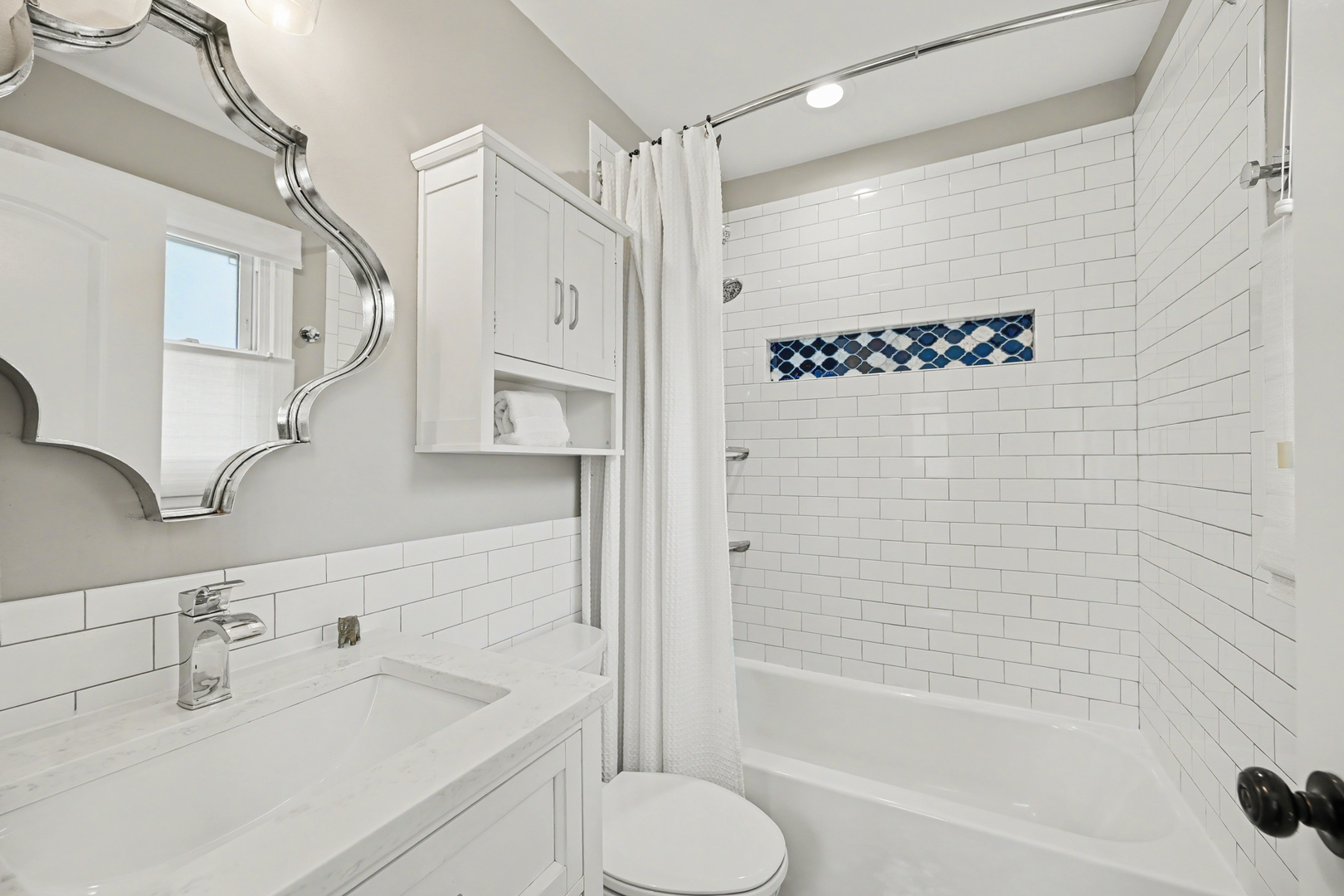 3S171 Arboretum Road Glen Ellyn, IL 60137 - Photo 14 of 41 a bathroom with a sink a toilet and shower