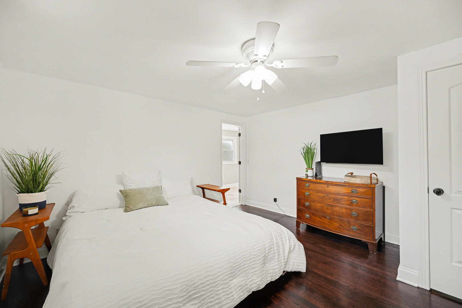 3S171 Arboretum Road Glen Ellyn, IL 60137 - Photo 17 of 41 a bedroom with a bed and a flat screen tv