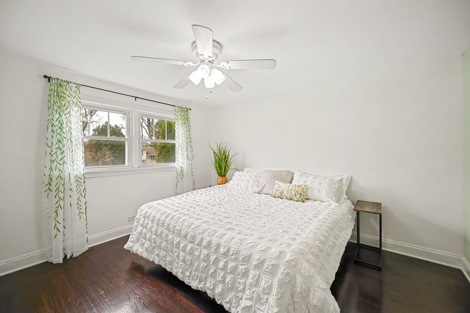 3S171 Arboretum Road Glen Ellyn, IL 60137 - Photo 20 of 41 a bedroom with a bed and wooden floor