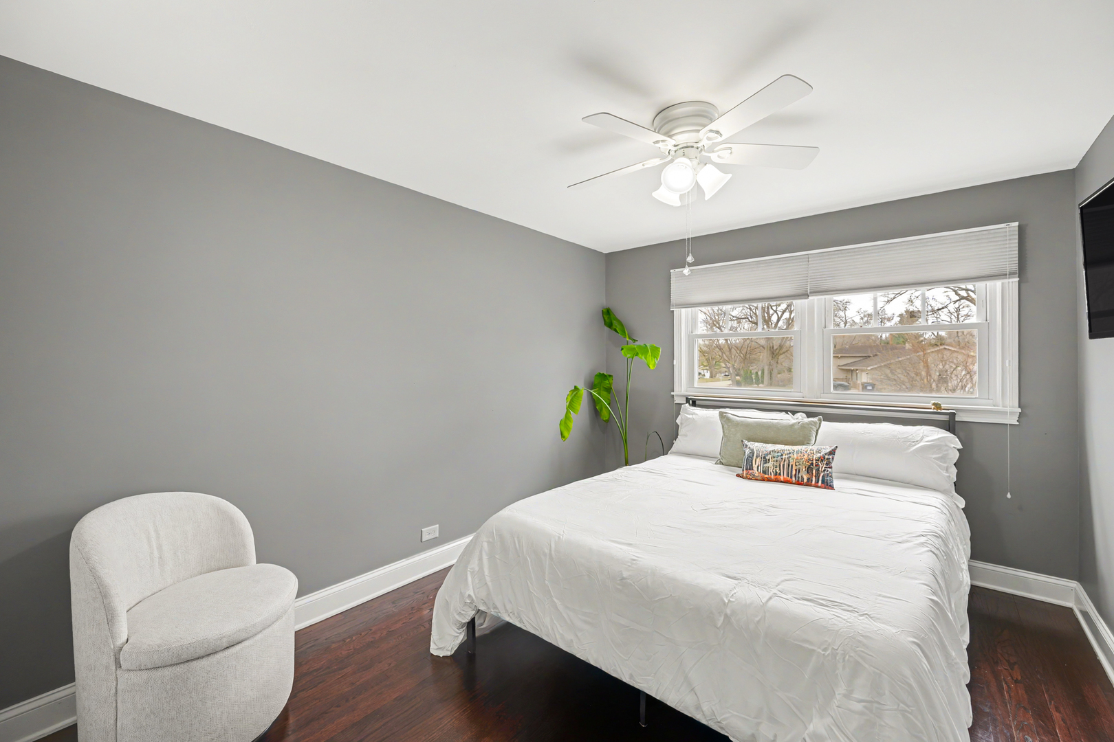 3S171 Arboretum Road Glen Ellyn, IL 60137 - Photo 22 of 41 a bedroom with a large bed and a chandelier