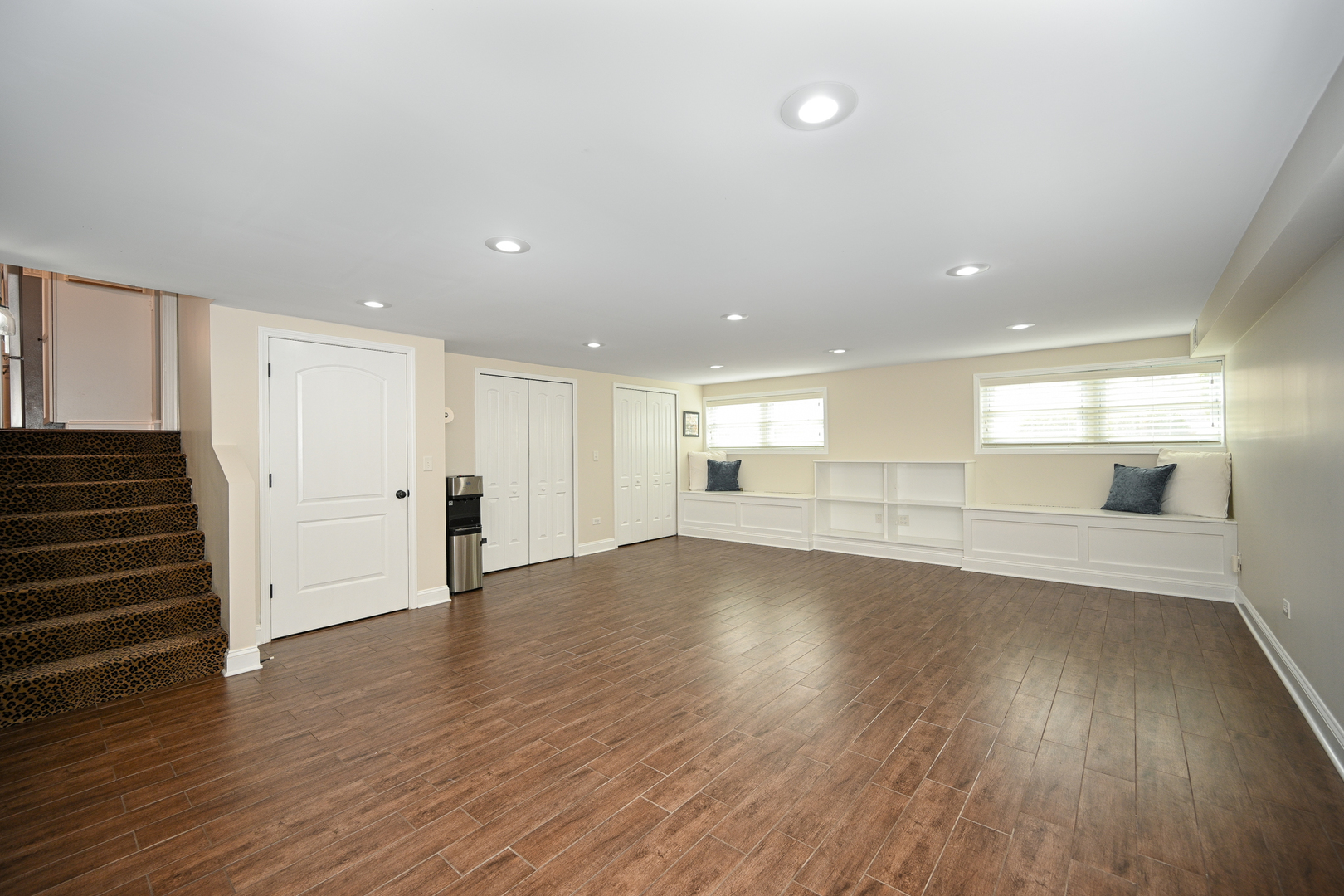 3S171 Arboretum Road Glen Ellyn, IL 60137 - Photo 25 of 41 a view of a big room with wooden floors and stairs