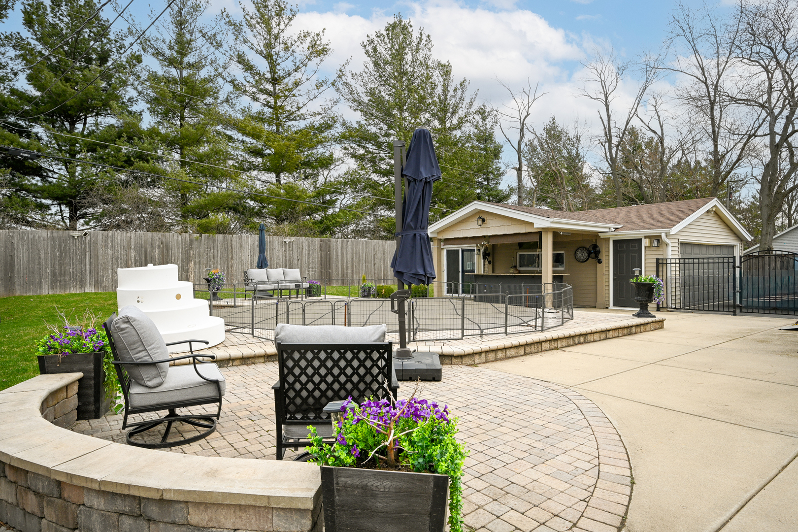 3S171 Arboretum Road Glen Ellyn, IL 60137 - Photo 30 of 41 a view of a house with backyard sitting area and garden