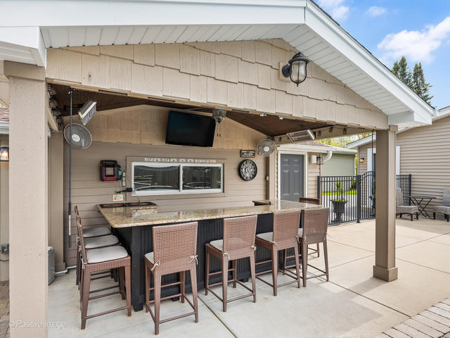 3S171 Arboretum Road Glen Ellyn, IL 60137 - Photo 31 of 41 a dinning table and chairs in the terrace