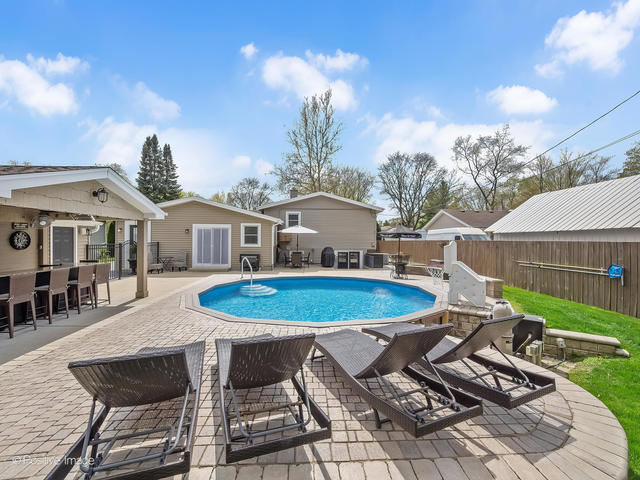 3S171 Arboretum Road Glen Ellyn, IL 60137 - Photo 33 of 41 a view of a house with pool and chairs