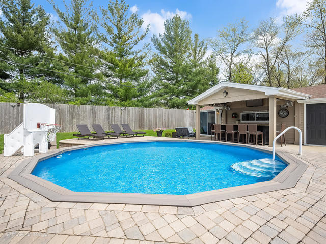 3S171 Arboretum Road Glen Ellyn, IL 60137 - Photo 36 of 41 a view of a swimming pool with a patio
