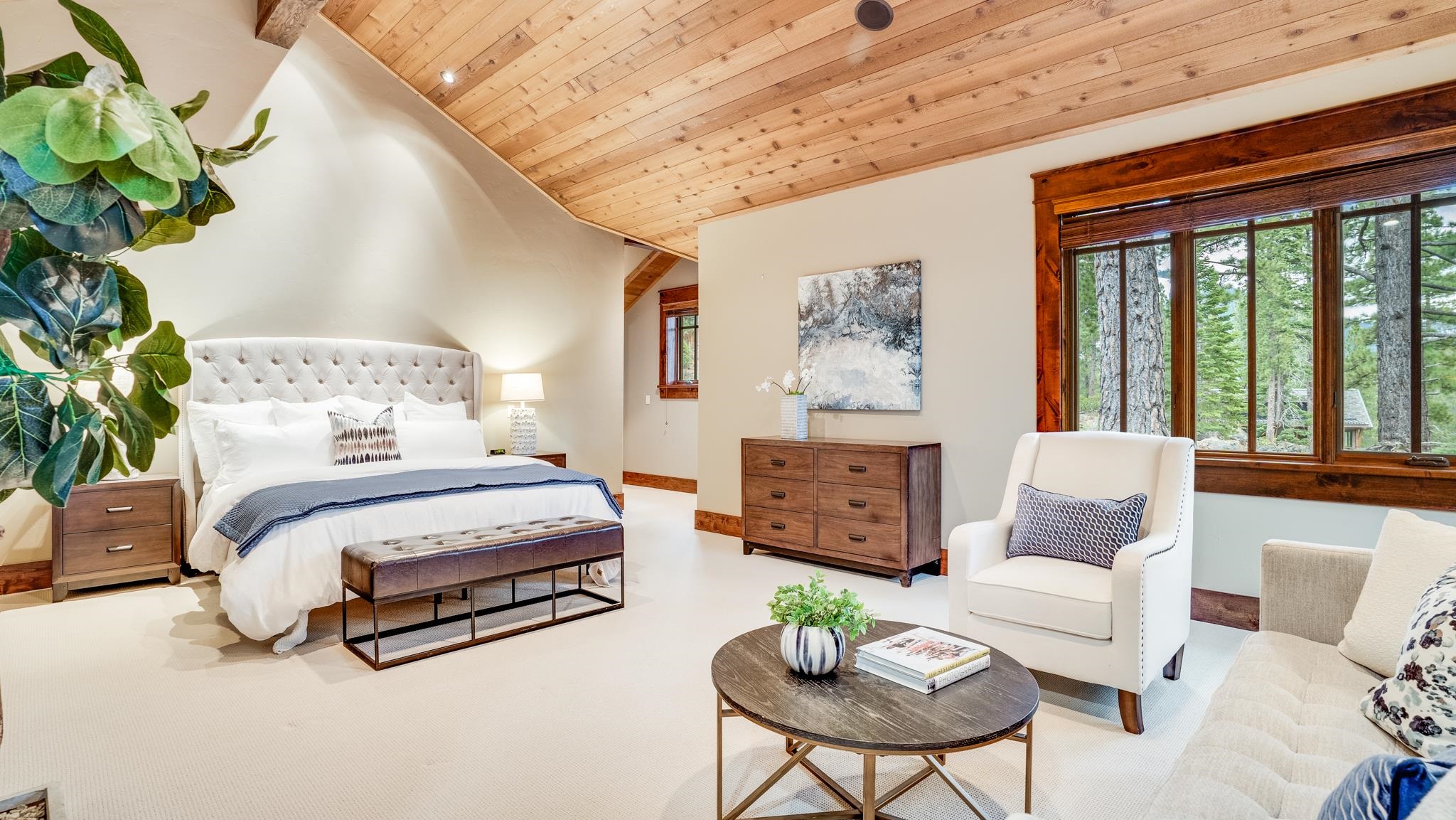 8602 Lloyd Tevis Drive Truckee, CA 96161 - Photo 12 of 21 a spacious bedroom with a bed and a couch