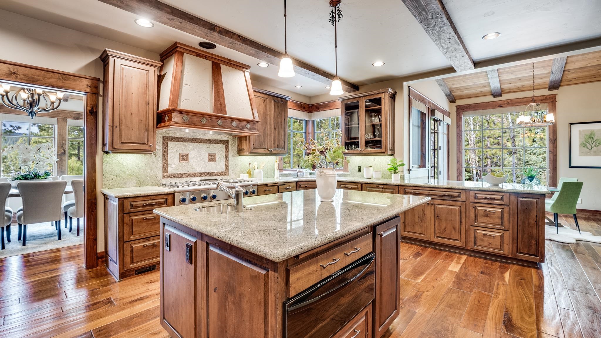 8602 Lloyd Tevis Drive Truckee, CA 96161 - Photo 9 of 21 a kitchen with granite countertop a stove a sink and wooden floor