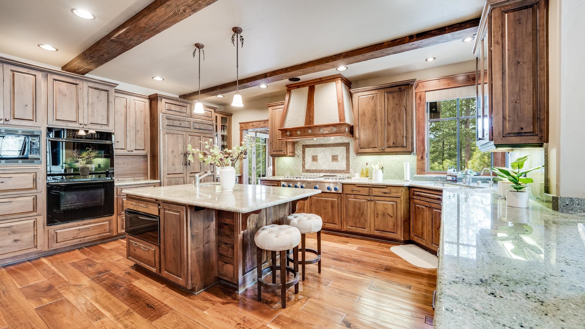 8602 Lloyd Tevis Drive Truckee, CA 96161 - Photo 10 of 21 a kitchen with a table chairs sink and cabinets