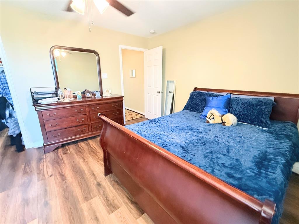 7838 Fm 937 Thornton, TX 76687 - Photo 15 of 30 a bedroom with a bed and a mirror on dresser