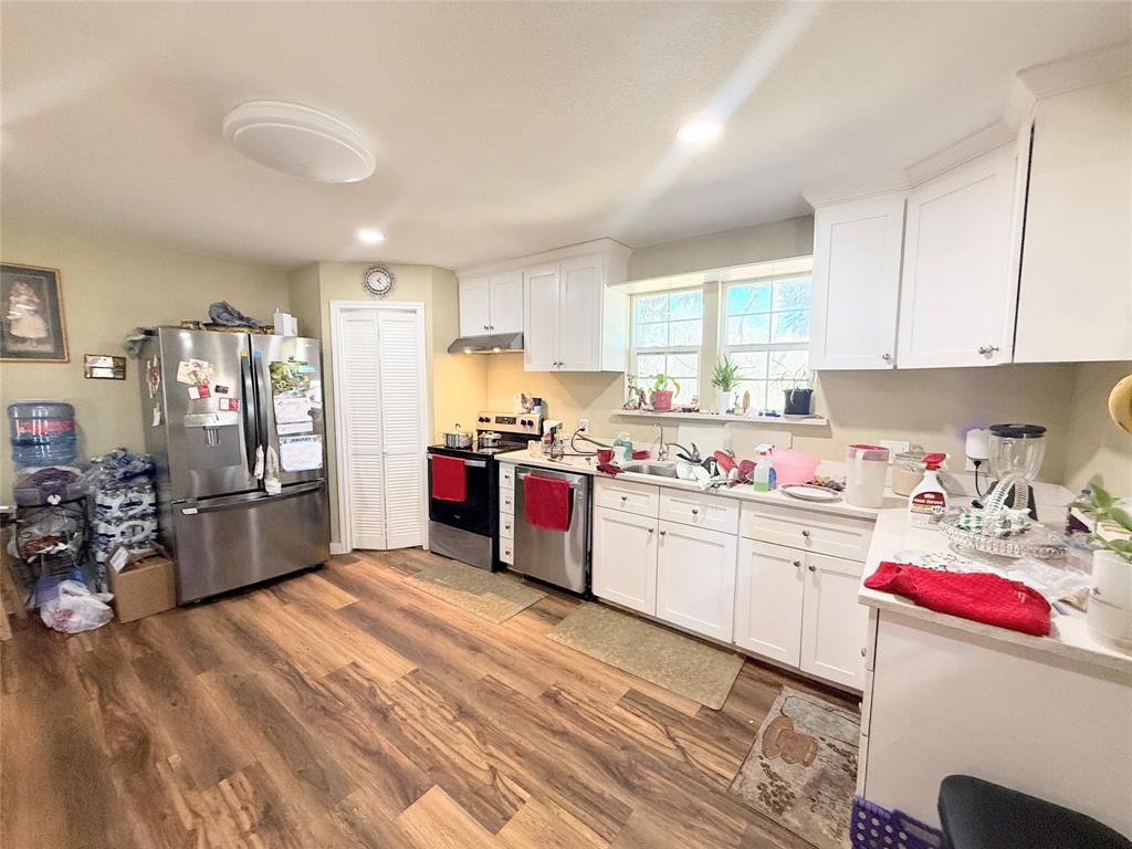7838 Fm 937 Thornton, TX 76687 - Photo 8 of 30 a kitchen with a sink window and cabinets