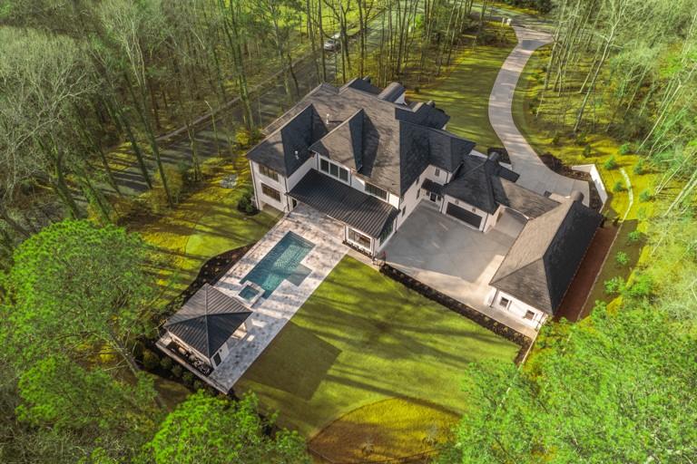 5211 Powers Ferry Road Northwest Sandy Springs, GA 30327 - Photo 2 of 106 an aerial view of residential house with outdoor space and swimming pool