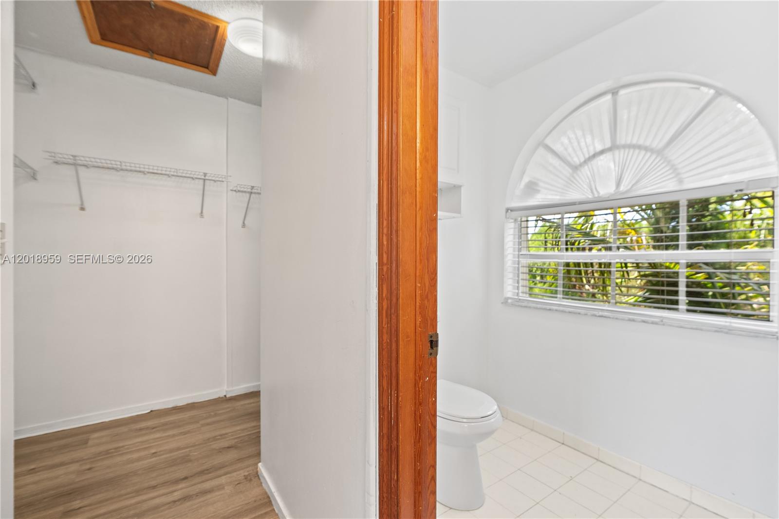 15345 Southwest 63rd Terrace Miami, FL 33193 - Photo 12 of 51 a bathroom with a toilet a sink and a window