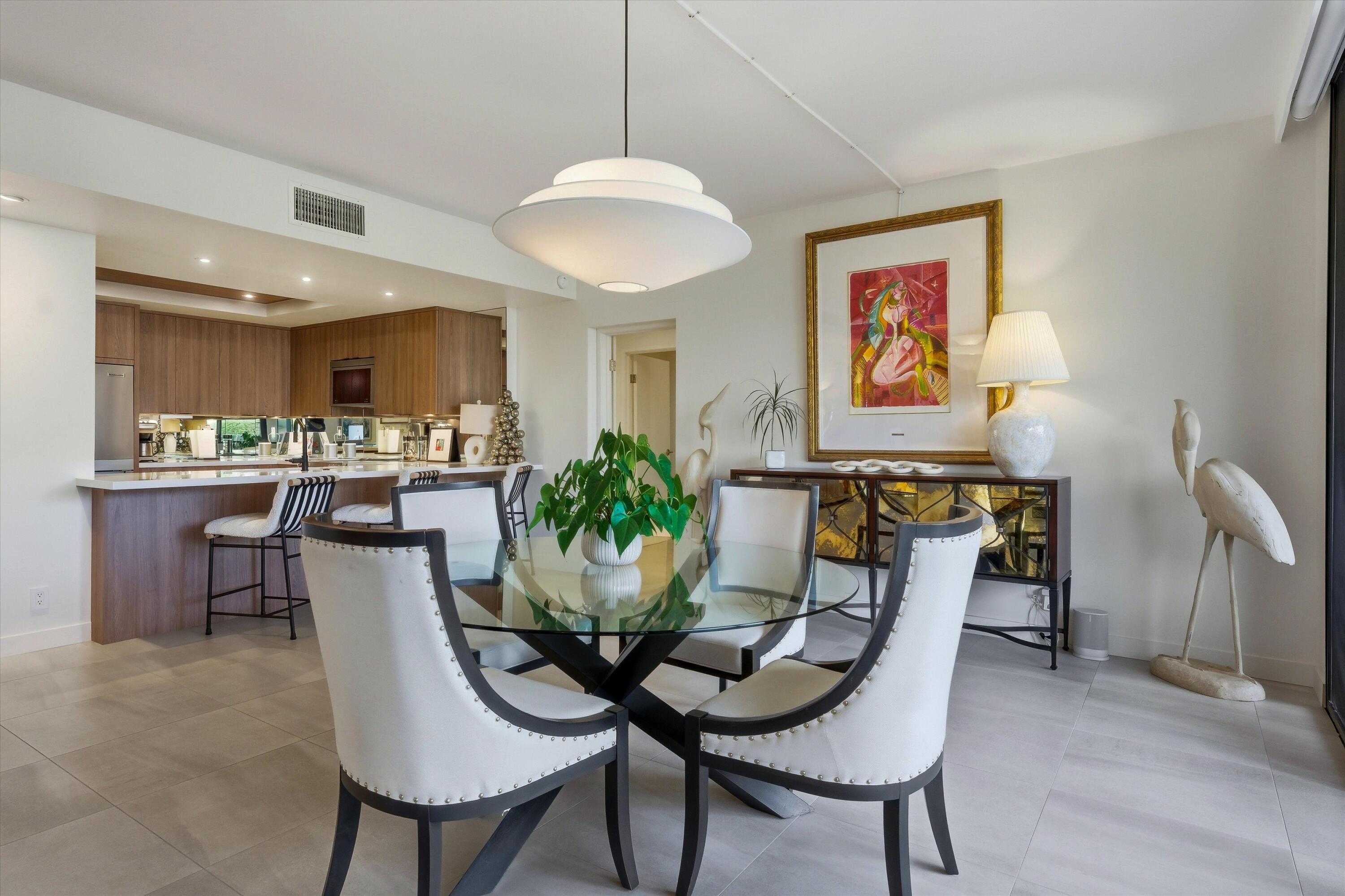910 Island Drive, Unit 110 Rancho Mirage, CA 92270 - Photo 11 of 30 a view of a dining room with furniture and wooden floor