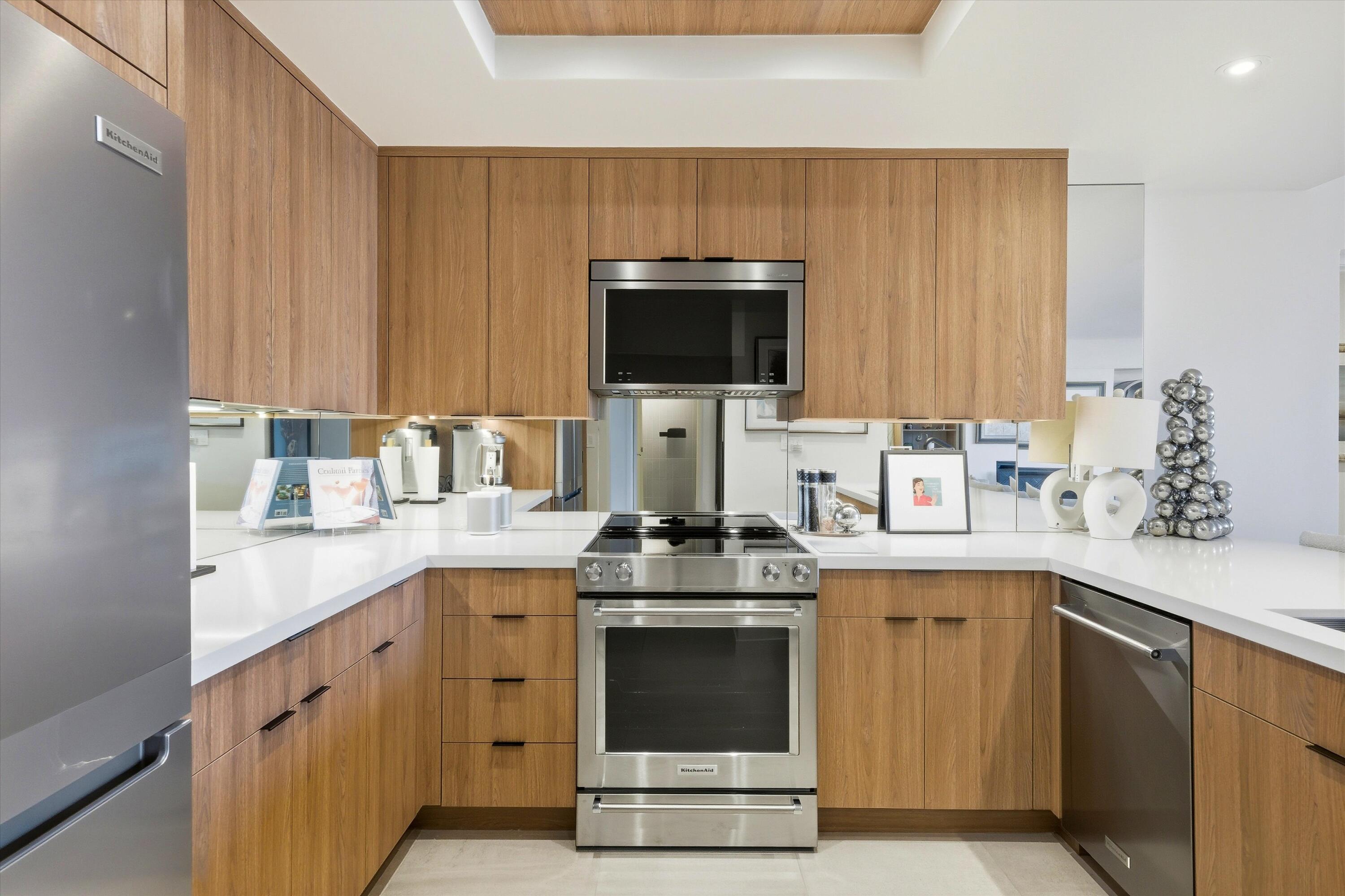910 Island Drive, Unit 110 Rancho Mirage, CA 92270 - Photo 8 of 30 a kitchen with a stove and a sink